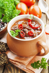 Chili soup with red beans and greens