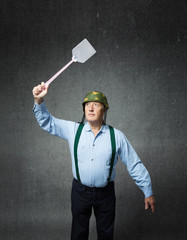 veteran soldier with a weapon for killing mosquito