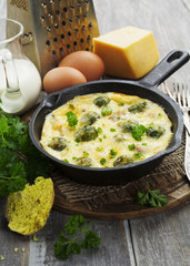Casserole with brussels sprouts and cheese in a frying pan