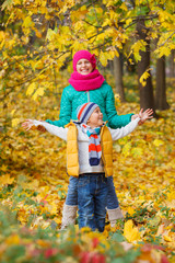 Cute kids with autumn leaves