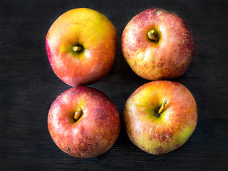 Four red apples, Belle de Boskoop