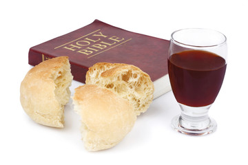 Bible, bread and wine isolated on white background