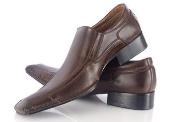 Two brown shoes isolated on white background