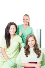 Beautiful dentist woman, patient and assistant.