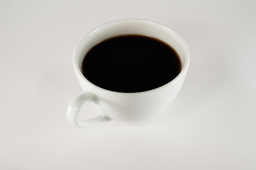 white cup of coffee on a white background