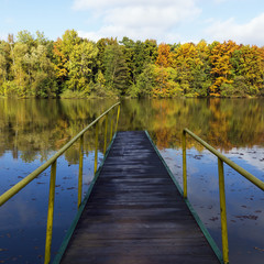 pier on a lake in autumn