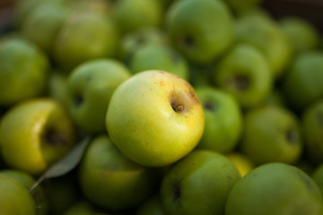 Green apples in box