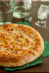Pizza with Ham, Salami, Tomatoes and Mozzarella Cheese