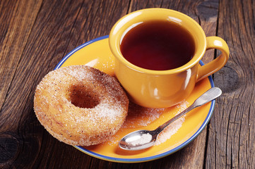 Donut with sugar and tea