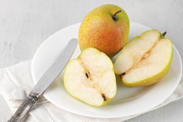 Pears on white plate
