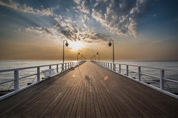 Sunrise on the pier at the seaside, Gdynia Orlowo, 