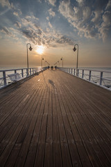 Sunrise on the pier at the seaside, Gdynia Orlowo,  - obrazy, fototapety, plakaty
