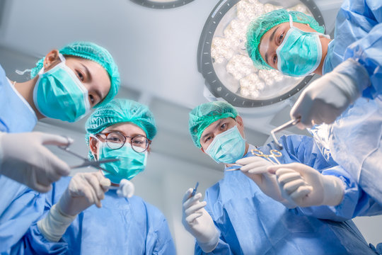 Surgery team operating in a surgical room