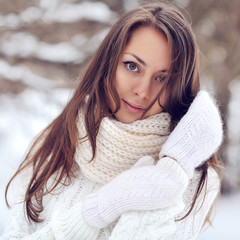Portrait of a beautiful girl in the winter