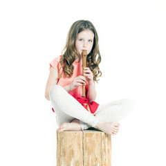 young girl with soprano recorder