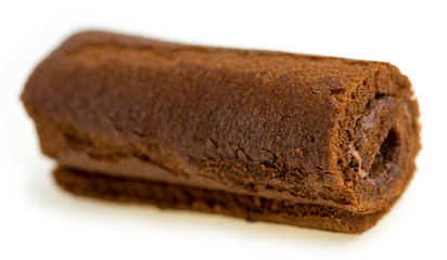 Macro of cream filled chocolate Swiss roll
