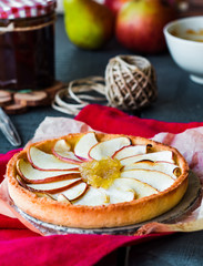 apple tart on a sand base with pear jam and caramel