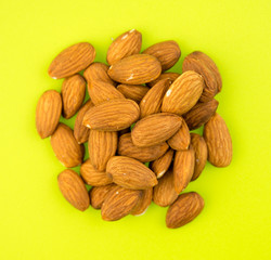 Almonds on green background