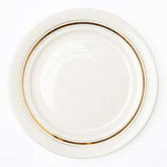 Plate with gold line decor isolated on white