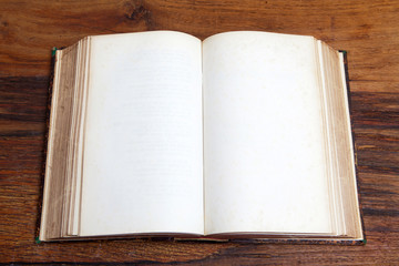 Open book on wooden table