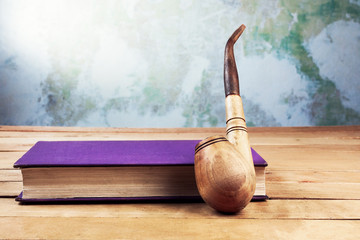 Smoking pipe and book