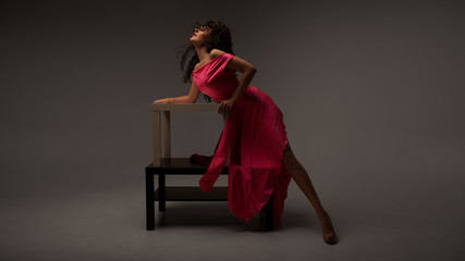 beautiful girl in a long pink dress