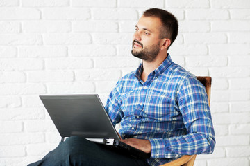 Casual man working with laptop