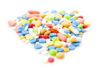  Pile of various colorful pills isolated on white