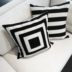 Black and white cushions on a sofa