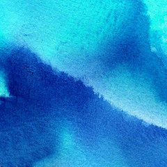 Abstract hand painted watercolor background of blue colors 