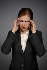 Businesswoman with strong migraine