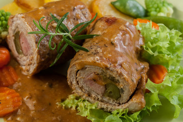 Pork rolls with prepared potatoes and vegetables