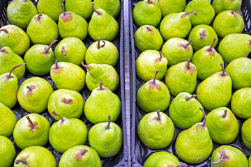Green pears for sale at a market