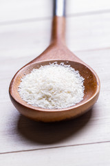 wooden spoon of desiccated coconut 