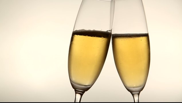 Two glasses with champagne toasting