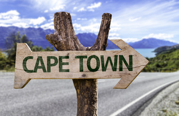 Cape Town wooden sign with a beach on background
