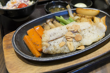 Dory fish steak with various vegetables