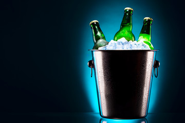 Beer bottles in ice bucket