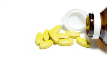 isolated. Yellow pills on white