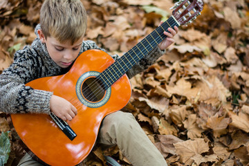 boy play guitar