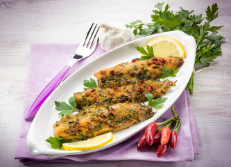 fish fillet with  hot chili pepper and parsley
