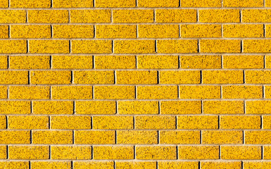 Energetic yellow brick wall as a background image with black vig