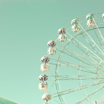 Vintage ferris wheel and tent in an amusement park