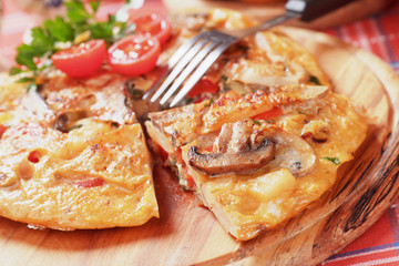 Tortilla, spanish omelette with mushrooms and tomato