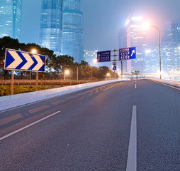 Asphalt road and modern city