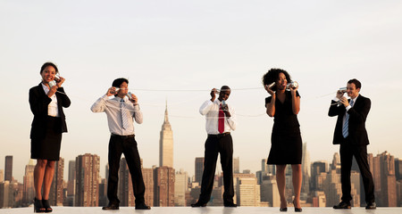 Obraz premium Group Of New York Office Workers Communicating