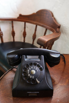 An old, old landline telephone on table
