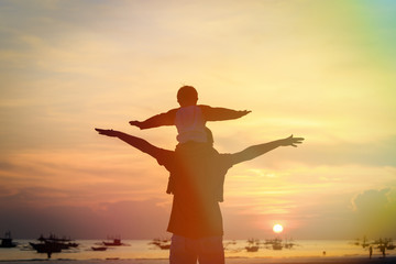 Fototapeta premium father and son having fun at sunset