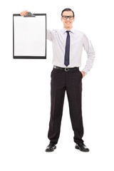 Young businessman holding a clipboard