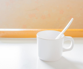 soft focus image of white cup